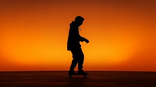 man skating with neon background